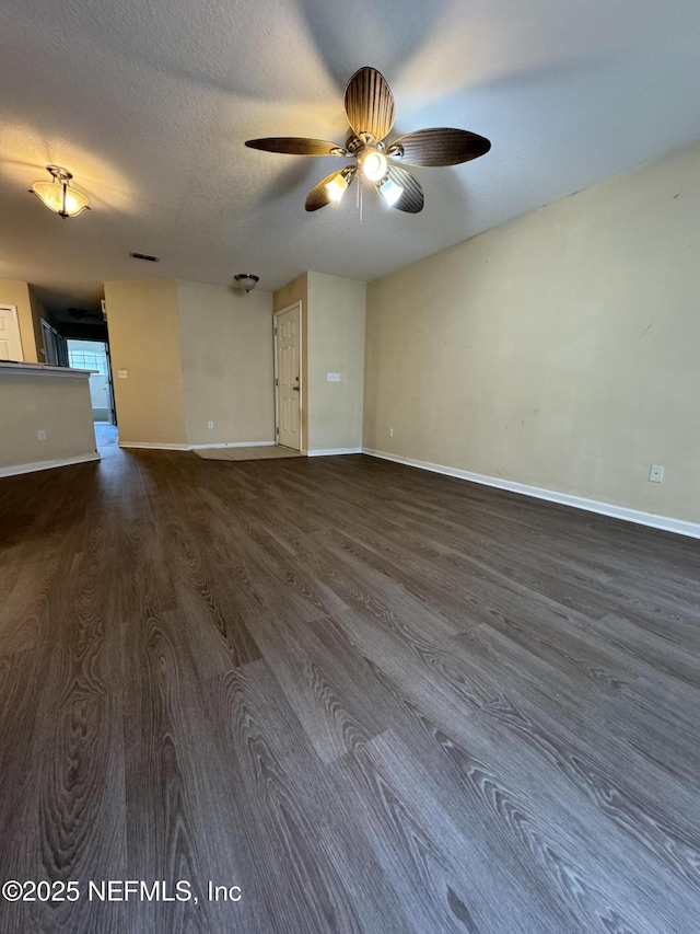 1815 Green Springs Cir Unit D, Fleming Island, FL 32003 - spare room with dark wood-style flooring, baseboards, and ceiling fan