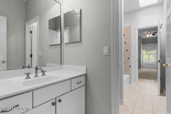 1821 Wind Ridge Ct, Fleming Island, FL 32003 - bathroom with vanity, tile patterned flooring, a skylight, baseboards, and shower / tub combination