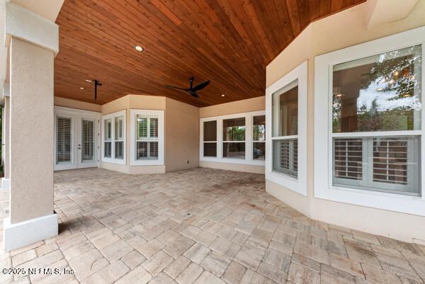 1821 Wind Ridge Ct, Fleming Island, FL 32003 - view of patio featuring ceiling fan and french doors