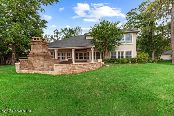 1821 Wind Ridge Ct, Fleming Island, FL 32003 - rear view of property featuring a lawn