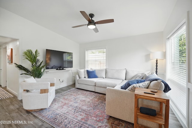 541 Margaret St, Neptune Beach, FL 32266 - living area featuring lofted ceiling, plenty of natural light, ceiling fan, wood finished floors, and baseboards