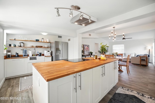 541 Margaret St, Neptune Beach, FL 32266 - kitchen with stainless steel fridge with ice dispenser, wooden counters, and wood finished floors