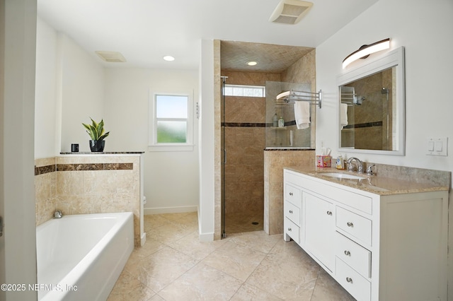 541 Margaret St, Neptune Beach, FL 32266 - bathroom with vanity, a stall shower, a garden tub, toilet, and baseboards