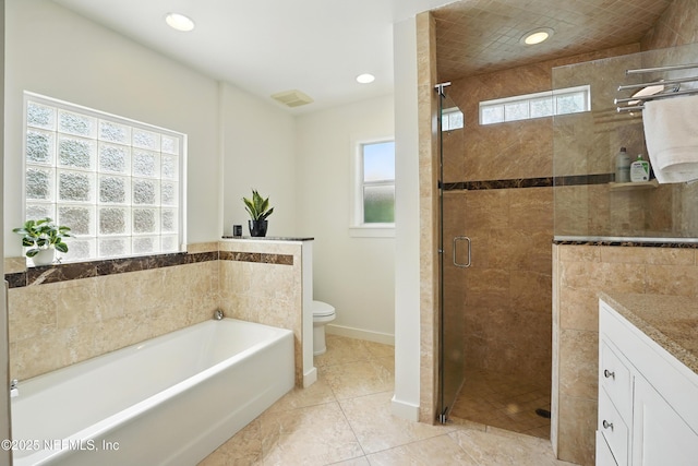 541 Margaret St, Neptune Beach, FL 32266 - bathroom with toilet, a garden tub, a shower stall, vanity, and baseboards
