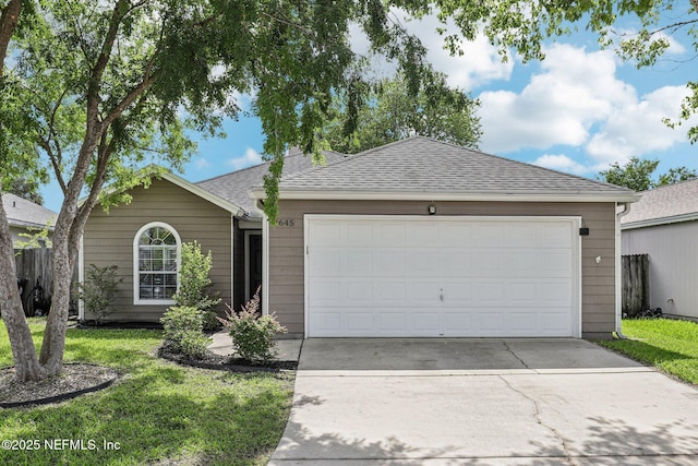 1645 Teaberry Dr, Middleburg, FL 32068 - ranch-style house with driveway, a shingled roof, and an attached garage