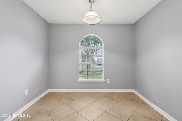1645 Teaberry Dr, Middleburg, FL 32068 - spare room featuring light tile patterned floors and a textured ceiling