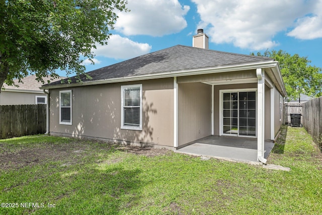 1645 Teaberry Dr, Middleburg, FL 32068 - rear view of property featuring a fenced backyard, a patio, a chimney, and roof with shingles