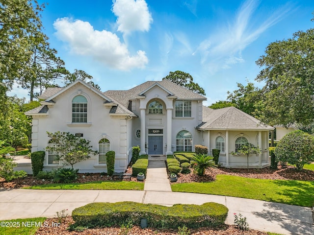 4427 Royal Tern Ct, Jacksonville Beach, FL 32250 - view of front of home featuring stucco siding and roof with shingles