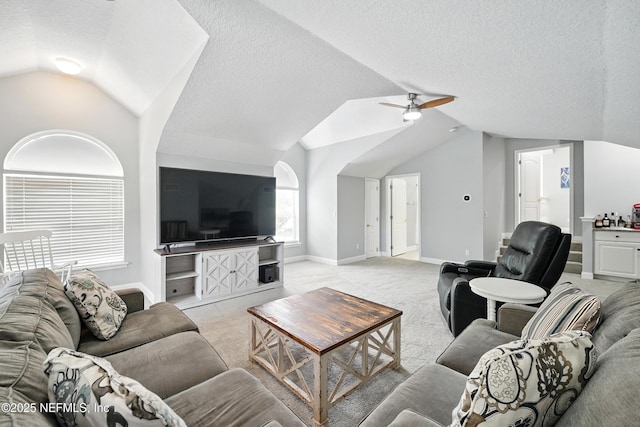 4427 Royal Tern Ct, Jacksonville Beach, FL 32250 - living area featuring vaulted ceiling, light carpet, a ceiling fan, and a textured ceiling