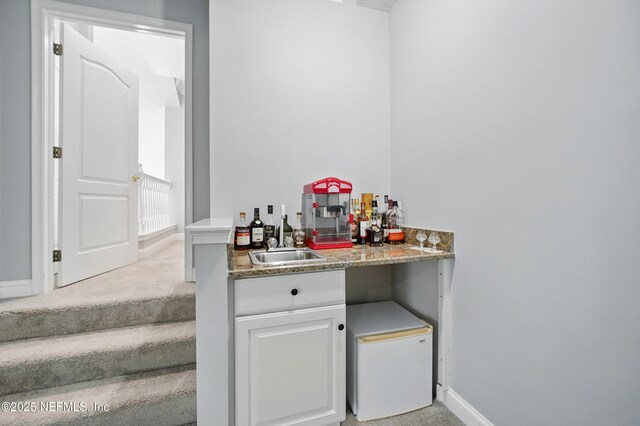 4427 Royal Tern Ct, Jacksonville Beach, FL 32250 - indoor bar with baseboards and light carpet