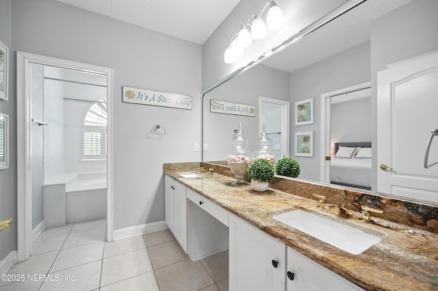4427 Royal Tern Ct, Jacksonville Beach, FL 32250 - full bathroom with double vanity, ensuite bath, tile patterned flooring, and a bath