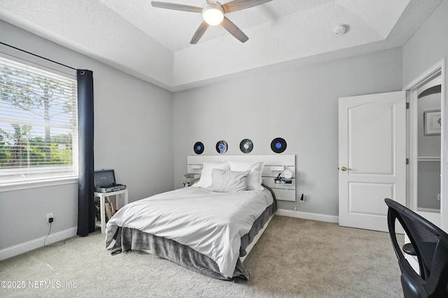 4427 Royal Tern Ct, Jacksonville Beach, FL 32250 - bedroom featuring light carpet, a textured ceiling, ceiling fan, and a raised ceiling