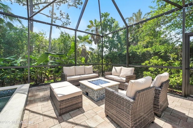 4427 Royal Tern Ct, Jacksonville Beach, FL 32250 - view of patio featuring an outdoor living space with a fire pit and glass enclosure