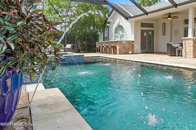 4427 Royal Tern Ct, Jacksonville Beach, FL 32250 - view of pool with a patio, a lanai, a pool with connected hot tub, and ceiling fan