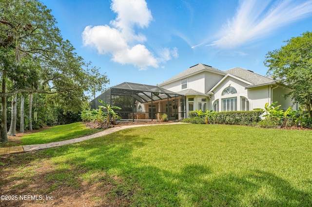 4427 Royal Tern Ct, Jacksonville Beach, FL 32250 - rear view of property with a yard, stucco siding, and a lanai