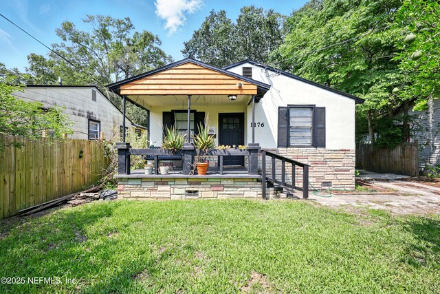 1176 Dancy St, Jacksonville, FL 32205 - bungalow-style home with stucco siding, a porch, and stone siding
