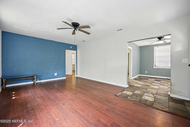 1176 Dancy St, Jacksonville, FL 32205 - unfurnished room featuring a ceiling fan, wood finished floors, and baseboards