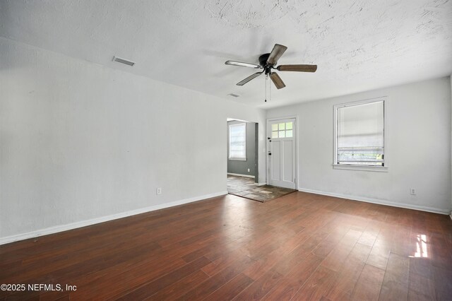 1176 Dancy St, Jacksonville, FL 32205 - empty room featuring a ceiling fan, wood-type flooring, and baseboards