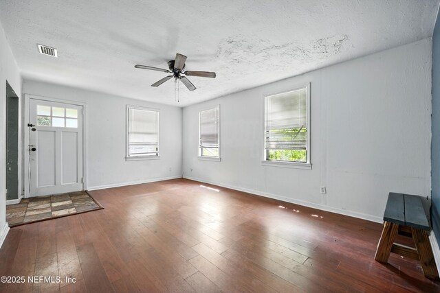 1176 Dancy St, Jacksonville, FL 32205 - entryway with ceiling fan, hardwood / wood-style flooring, baseboards, and a textured ceiling
