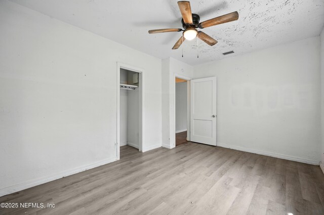 1176 Dancy St, Jacksonville, FL 32205 - unfurnished bedroom featuring wood finished floors, baseboards, a closet, and a ceiling fan