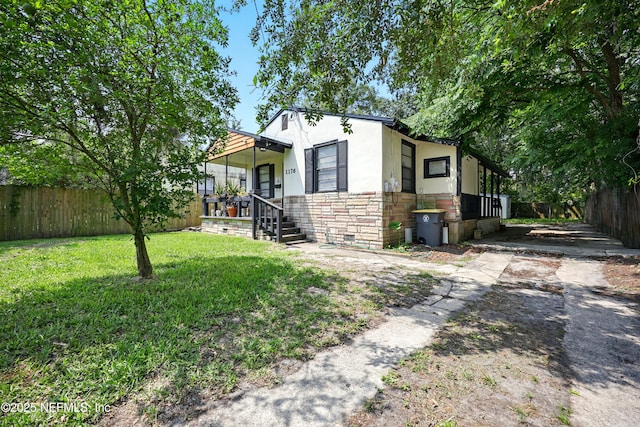 1176 Dancy St, Jacksonville, FL 32205 - view of front facade with stone siding and stucco siding