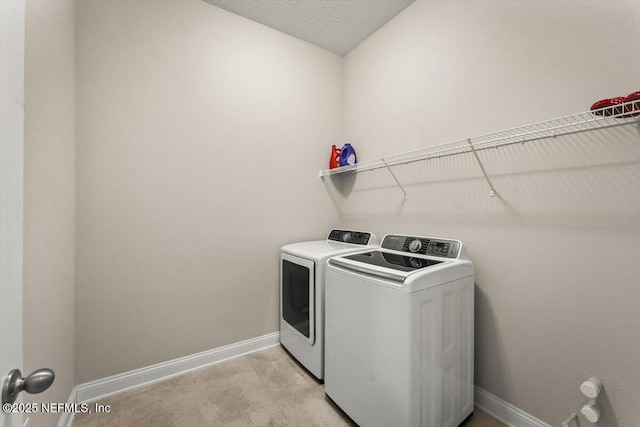 286 Holly Landing Way, Saint Augustine, FL 32092 - laundry area with washer and dryer and baseboards