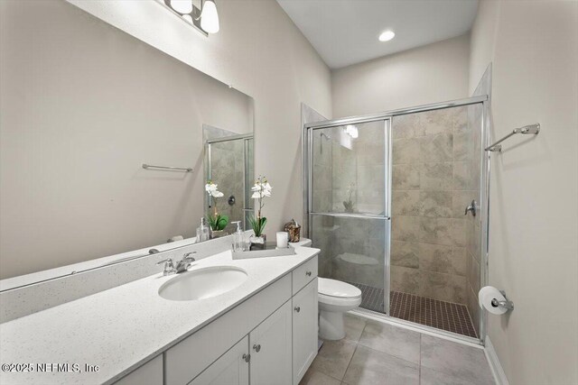 286 Holly Landing Way, Saint Augustine, FL 32092 - full bath featuring toilet, vanity, a stall shower, and tile patterned floors