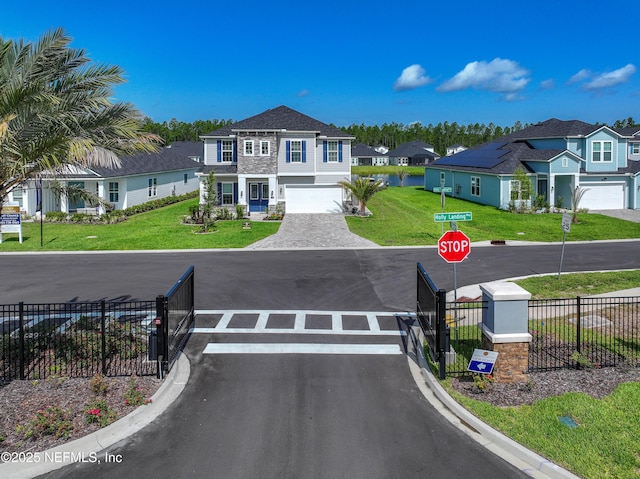 286 Holly Landing Way, Saint Augustine, FL 32092 - view of asphalt road with traffic signs, a residential view, a gated entry, and curbs