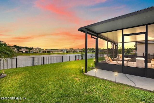 3448 Cliffside Way, Green Cove Springs, FL 32043 - yard at dusk with a water view, a patio area, and a residential view