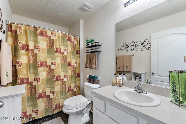 3448 Cliffside Way, Green Cove Springs, FL 32043 - bathroom featuring vanity, toilet, a textured ceiling, and a shower with curtain