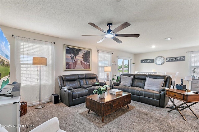 3448 Cliffside Way, Green Cove Springs, FL 32043 - carpeted living room featuring a ceiling fan and a textured ceiling