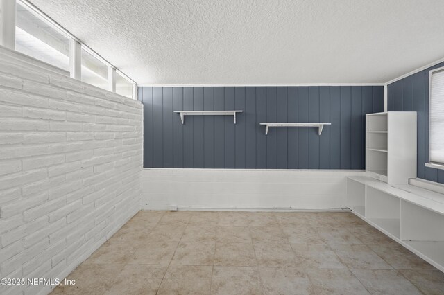 3121 Holly Berry Ln, Jacksonville, FL 32277 - tiled empty room featuring a textured ceiling