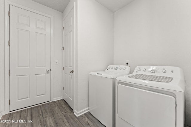 3430 Traceland Oak Ln, Green Cove Springs, FL 32043 - laundry area with independent washer and dryer, dark wood-style flooring, and baseboards