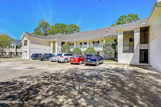 112 Laurel Wood Way Unit 202, Saint Augustine, FL 32086 - view of building exterior featuring uncovered parking