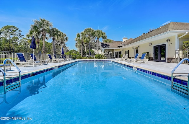 112 Laurel Wood Way Unit 202, Saint Augustine, FL 32086 - community pool with french doors and a patio area