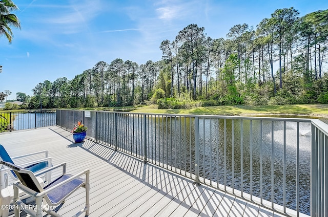 112 Laurel Wood Way Unit 202, Saint Augustine, FL 32086 - wooden deck with a water view and view of scattered trees