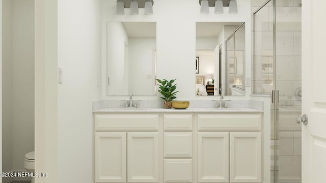 28 Hogan Ct, Saint Augustine, FL 32092 - full bathroom featuring a shower stall, double vanity, toilet, and ensuite bathroom