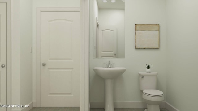 28 Hogan Ct, Saint Augustine, FL 32092 - half bath featuring baseboards, toilet, and a sink