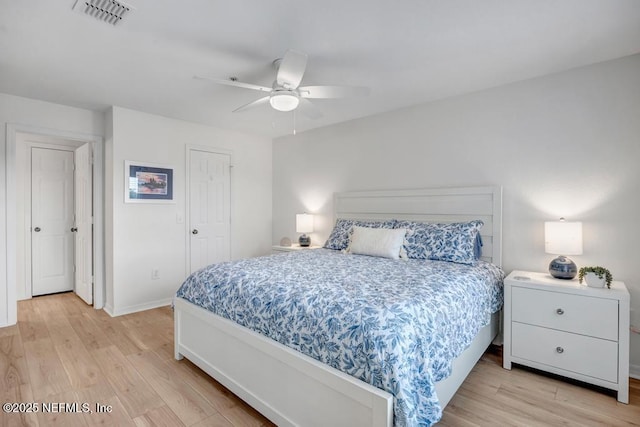 10961 Burnt Mill Rd Unit 1534, Jacksonville, FL 32256 - bedroom with light wood-style floors, baseboards, and a ceiling fan