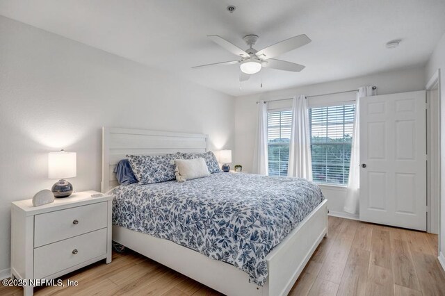 10961 Burnt Mill Rd Unit 1534, Jacksonville, FL 32256 - bedroom featuring light wood finished floors, a ceiling fan, and baseboards