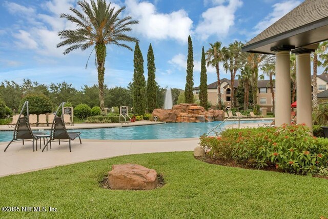 10961 Burnt Mill Rd Unit 1534, Jacksonville, FL 32256 - community pool featuring a lawn and a patio