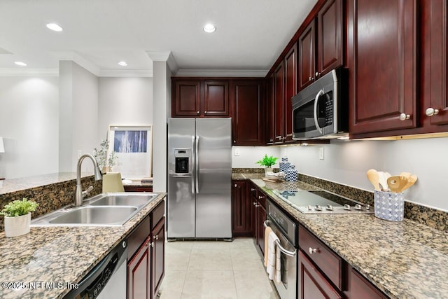 4300 S Beach Pkwy Unit 3313, Jacksonville Beach, FL 32250 - kitchen with stainless steel appliances, reddish brown cabinets, crown molding, a sink, and recessed lighting