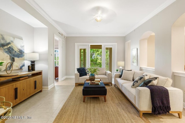 4300 S Beach Pkwy Unit 3313, Jacksonville Beach, FL 32250 - living room featuring arched walkways, light tile patterned floors, crown molding, and baseboards