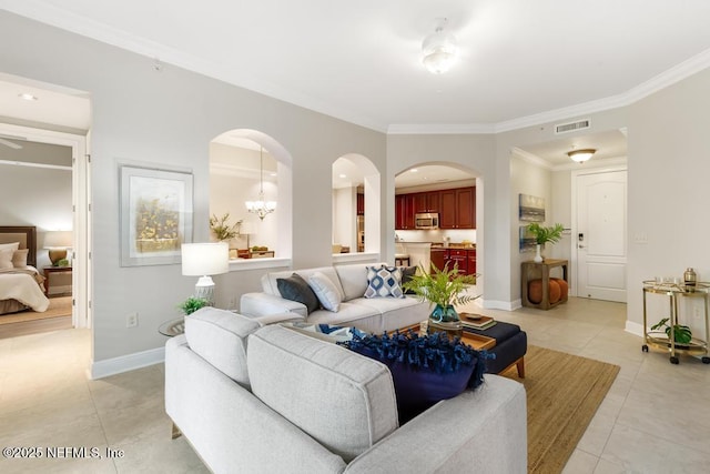 4300 S Beach Pkwy Unit 3313, Jacksonville Beach, FL 32250 - living room with light tile patterned floors, arched walkways, crown molding, and baseboards