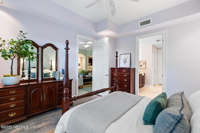 4300 S Beach Pkwy Unit 3313, Jacksonville Beach, FL 32250 - bedroom with arched walkways, ensuite bathroom, and a ceiling fan