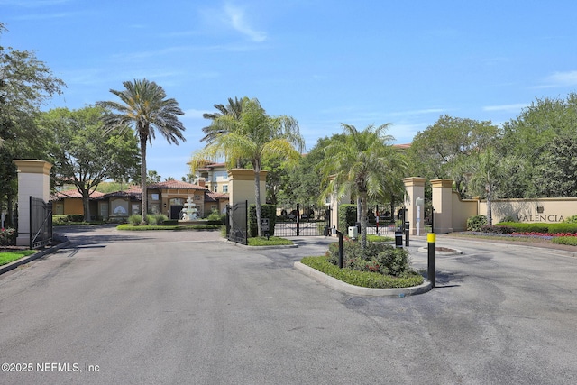 4300 S Beach Pkwy Unit 3313, Jacksonville Beach, FL 32250 - view of asphalt street featuring a gate, a gated entry, and curbs