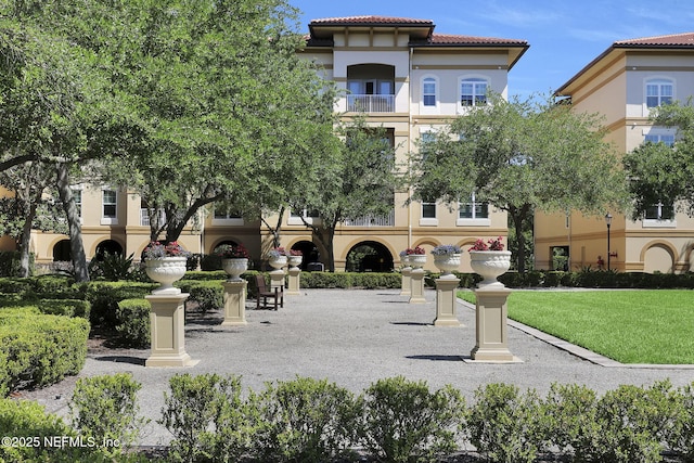 4300 S Beach Pkwy Unit 3313, Jacksonville Beach, FL 32250 - surrounding community featuring a lawn