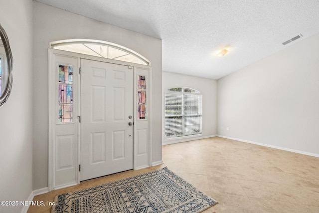 4458 Deep River Way E, Jacksonville, FL 32224 - tiled foyer entrance with a textured ceiling and baseboards