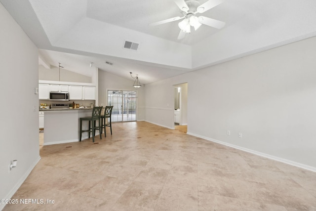 4458 Deep River Way E, Jacksonville, FL 32224 - living area featuring lofted ceiling, ceiling fan, and light tile patterned flooring