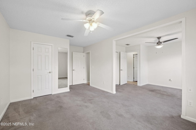4458 Deep River Way E, Jacksonville, FL 32224 - unfurnished bedroom with carpet flooring, a textured ceiling, and ceiling fan